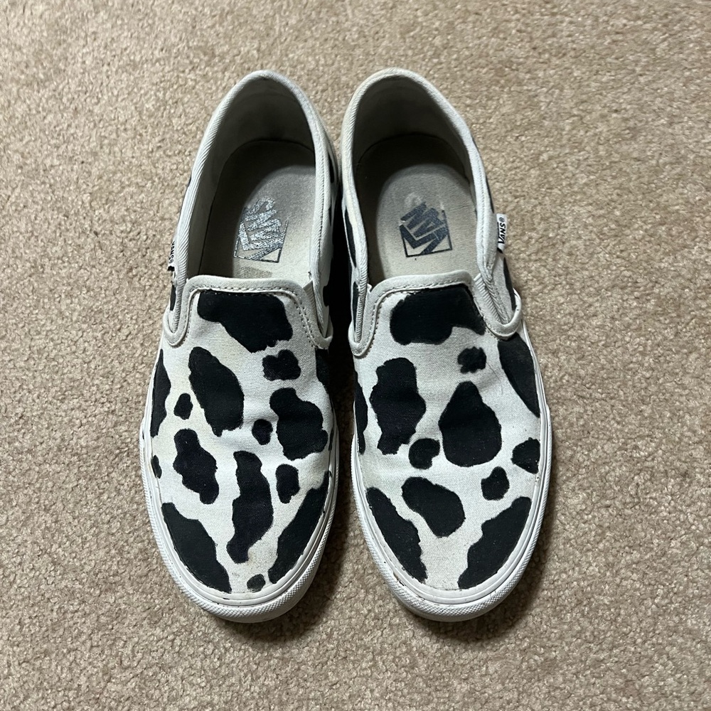 Vans Classic Slip-On Cow Print Canvas Flats in White and Black
